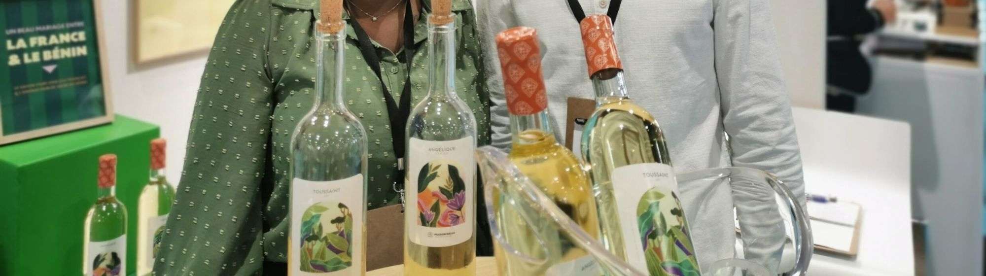 Maison Dalla showcasing elegant wine bottles with artistic labels, representing a cultural blend of France and Benin