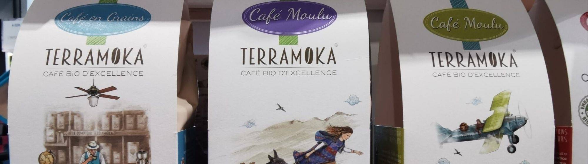 Terramoka organic coffee products displayed with unique packaging illustrations and labels indicating premium quality and eco-friendliness