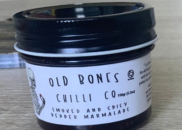 Jar of smoked and spicy pepper marmalade from the Old Bones Chili Co brand.